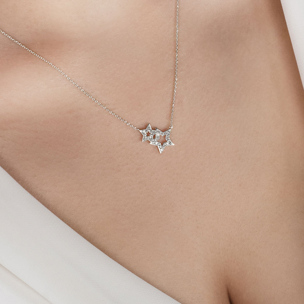 Double Star Diamond Necklace in White Gold Worn By A Woman