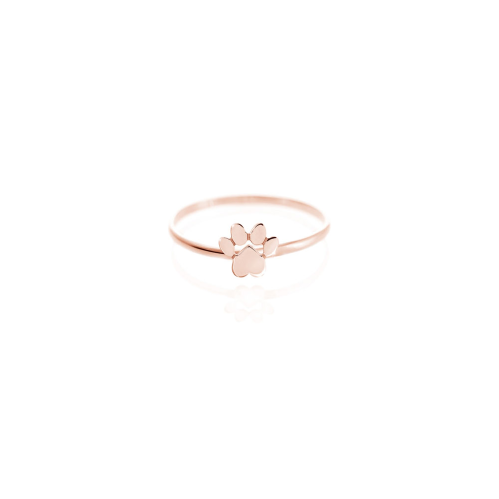 a rose gold ring with a tiny paw print