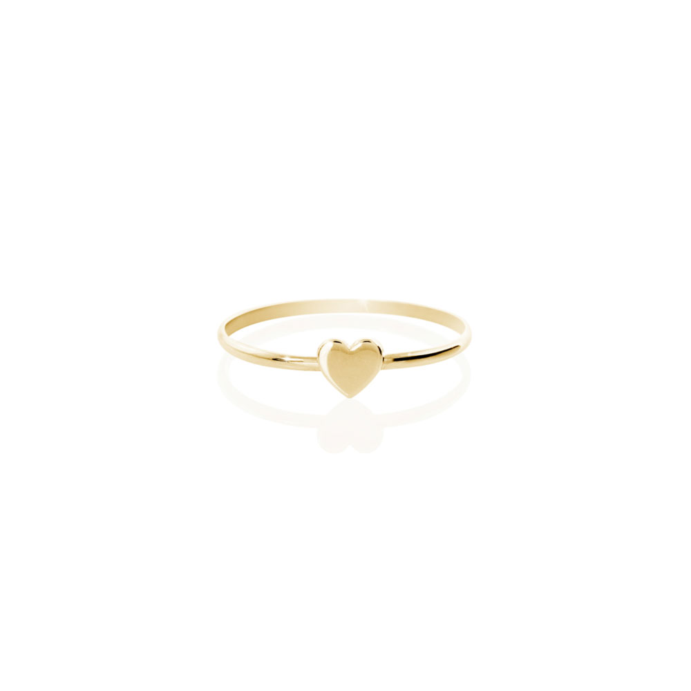 a yellow gold ring with a tiny heart
