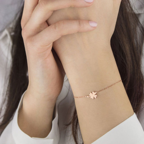 Lucky Bracelet with a Rose Gold 4-Leaf Clover Charm Worn By A Woman