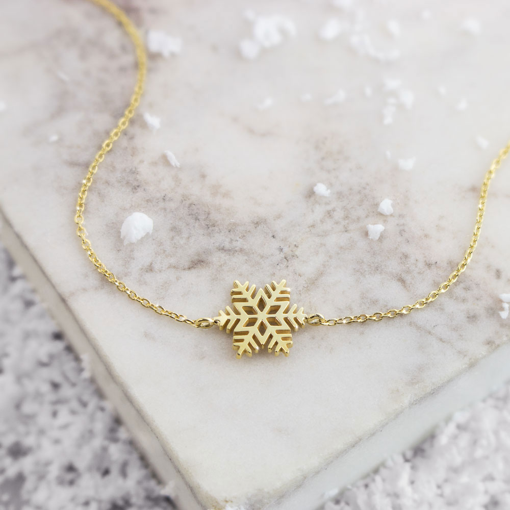 Yellow Gold Charm Bracelet with a Unique Snowflake