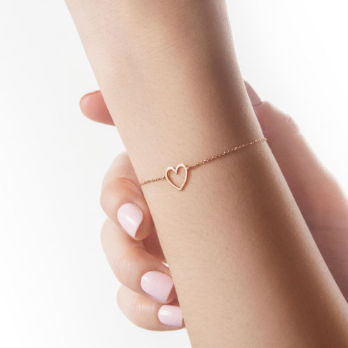 Romantic Bracelet with a Rose Gold Heart Worn By A Woman
