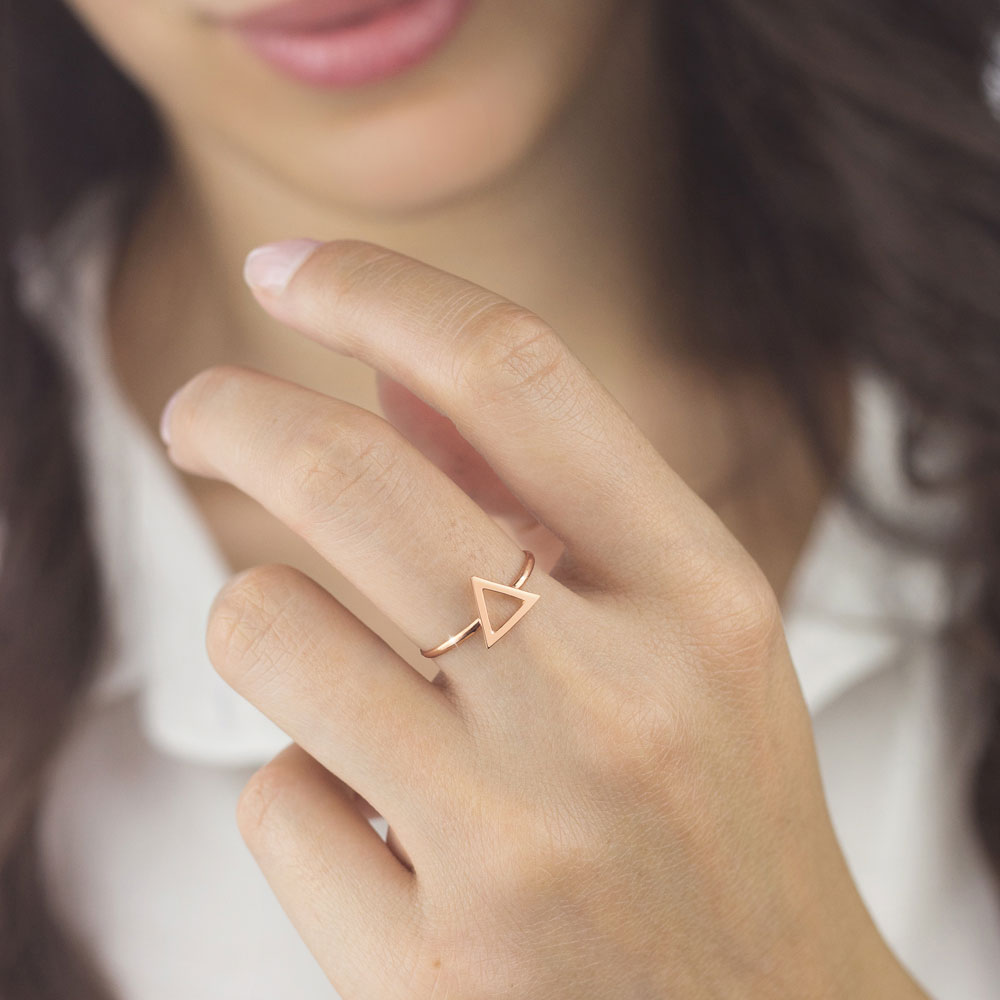Rose Gold Band Ring with a Small Triangle Worn By A Woman