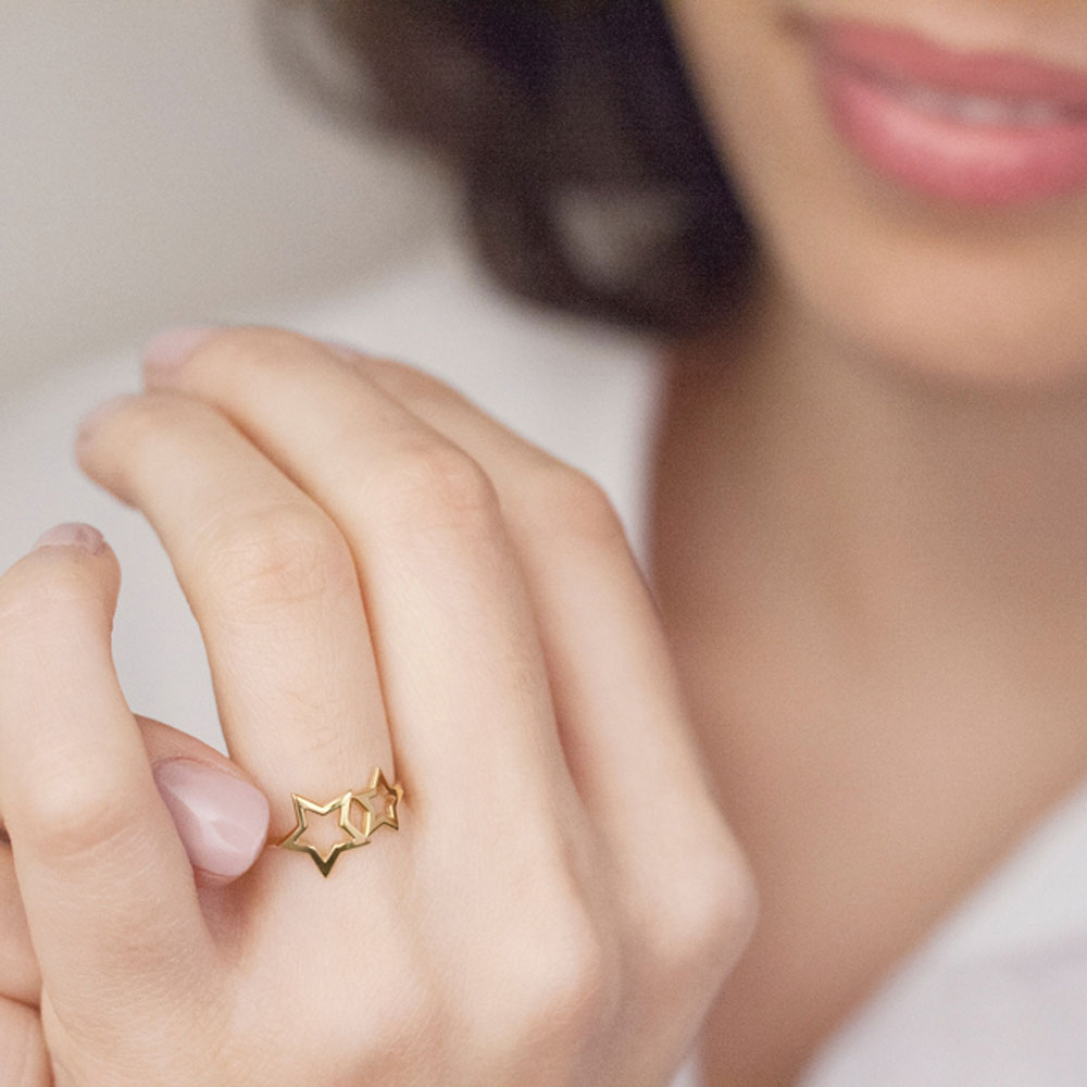 Yellow Gold Ring with Two Stars Worn By A Woman