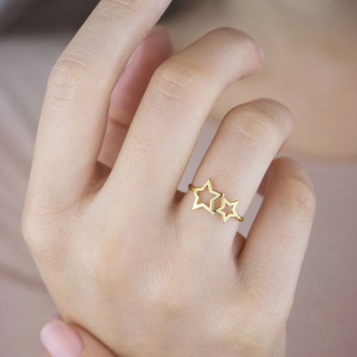 Yellow Gold Ring with Two Stars Worn By A Woman