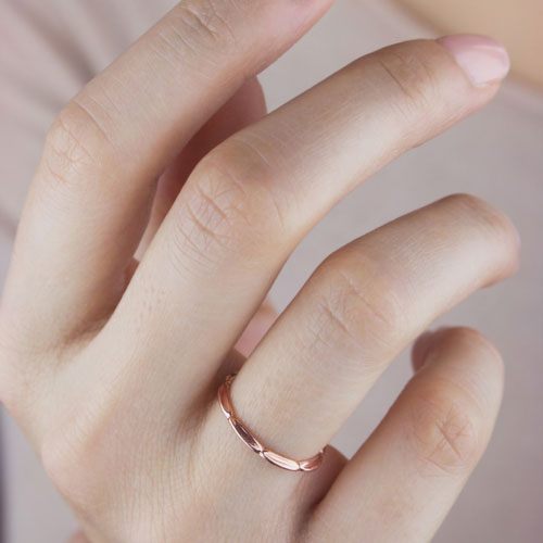 Unique Embossed Ring in Rose Gold Worn By A Woman