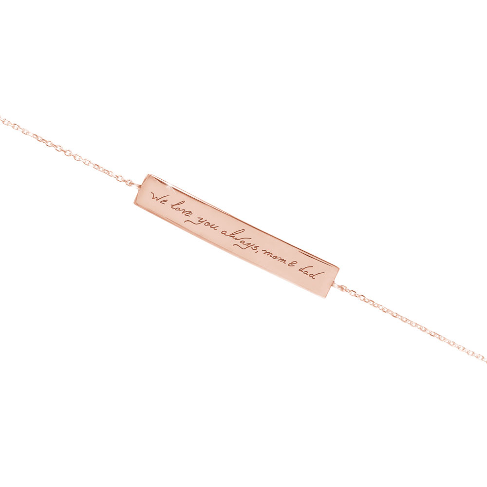 a handwritten bar bracelet in rose gold