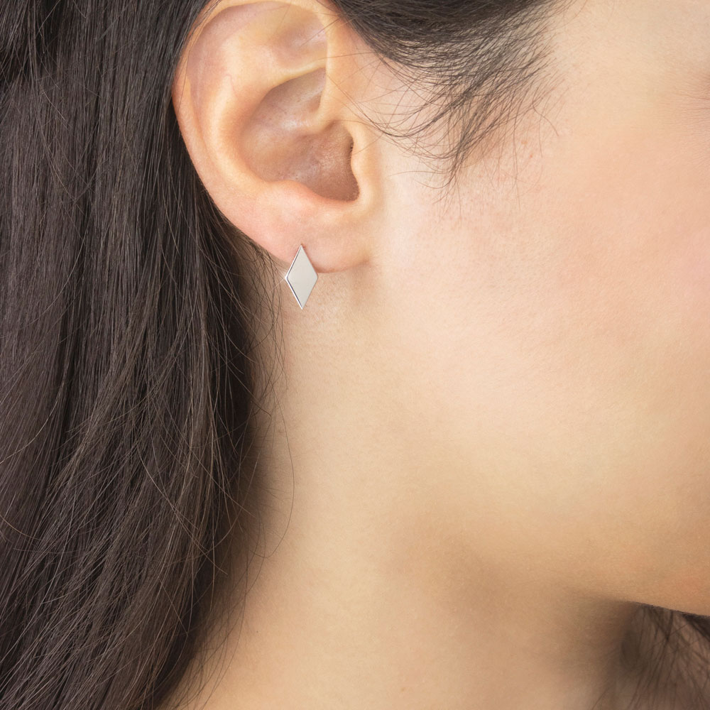 Dainty Rhombus White Gold Stud Earrings Worn By A Woman