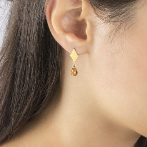 Rhombus Yellow Gold Studs with a Tiny Dangling Citrine Worn By A Woman
