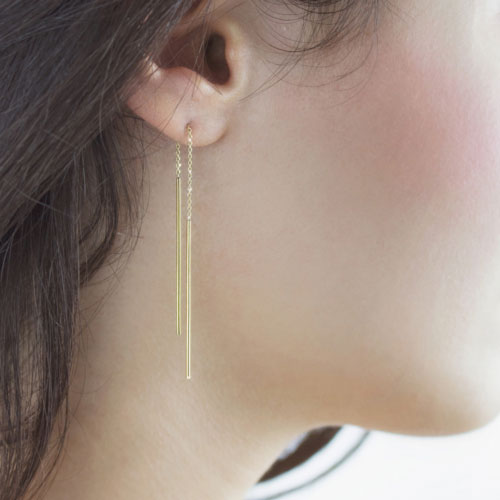 Yellow Gold Threader Earrings with Two Thin Bars Worn By A Woman