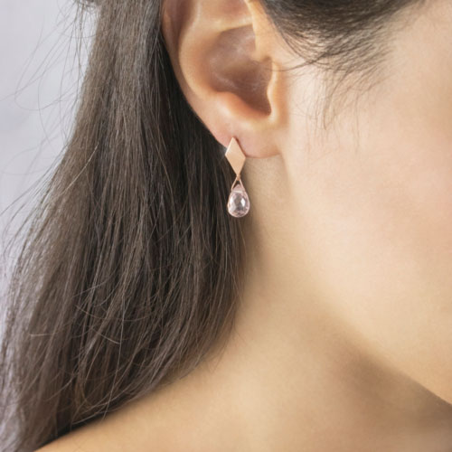 Small Dangling Pink Quartz With Rose Gold Rhombus Stud Earrings Worn By A Woman