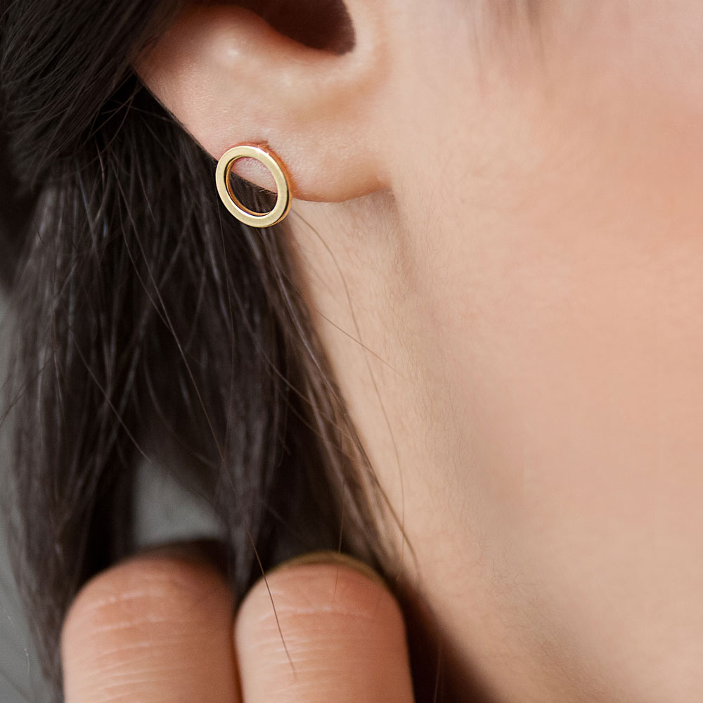 Yellow Gold Simple Circle Stud Earrings Worn By A Woman