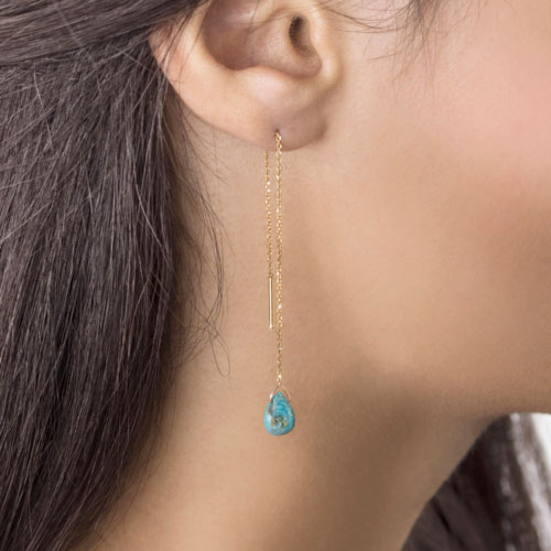 Yellow Gold Threader Earrings with a Small Turquoise Worn By A Woman