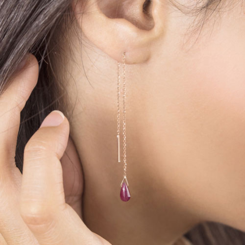 Rose Gold Threader Earrings with a Tiny Ruby Worn By A Woman