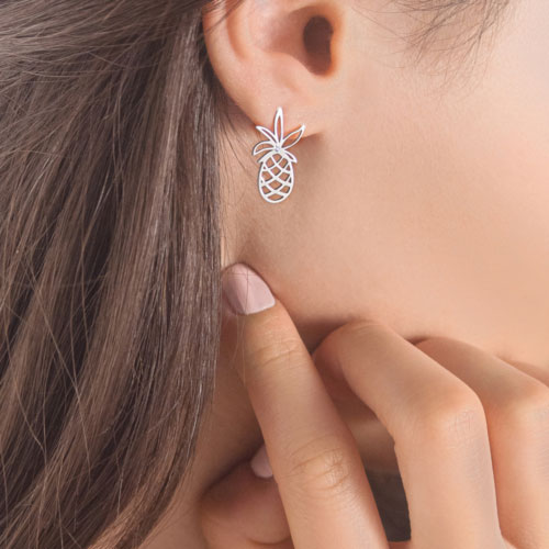 White Gold Dainty Pineapple Stud Earrings with a Tiny White Diamond Worn By A Woman