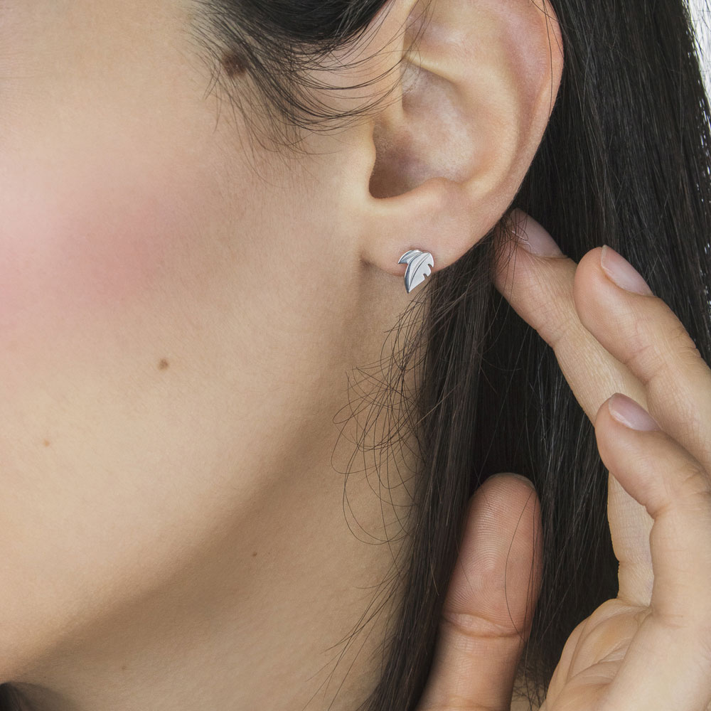 Double Leaf White Gold Stud Earrings Worn By A Woman