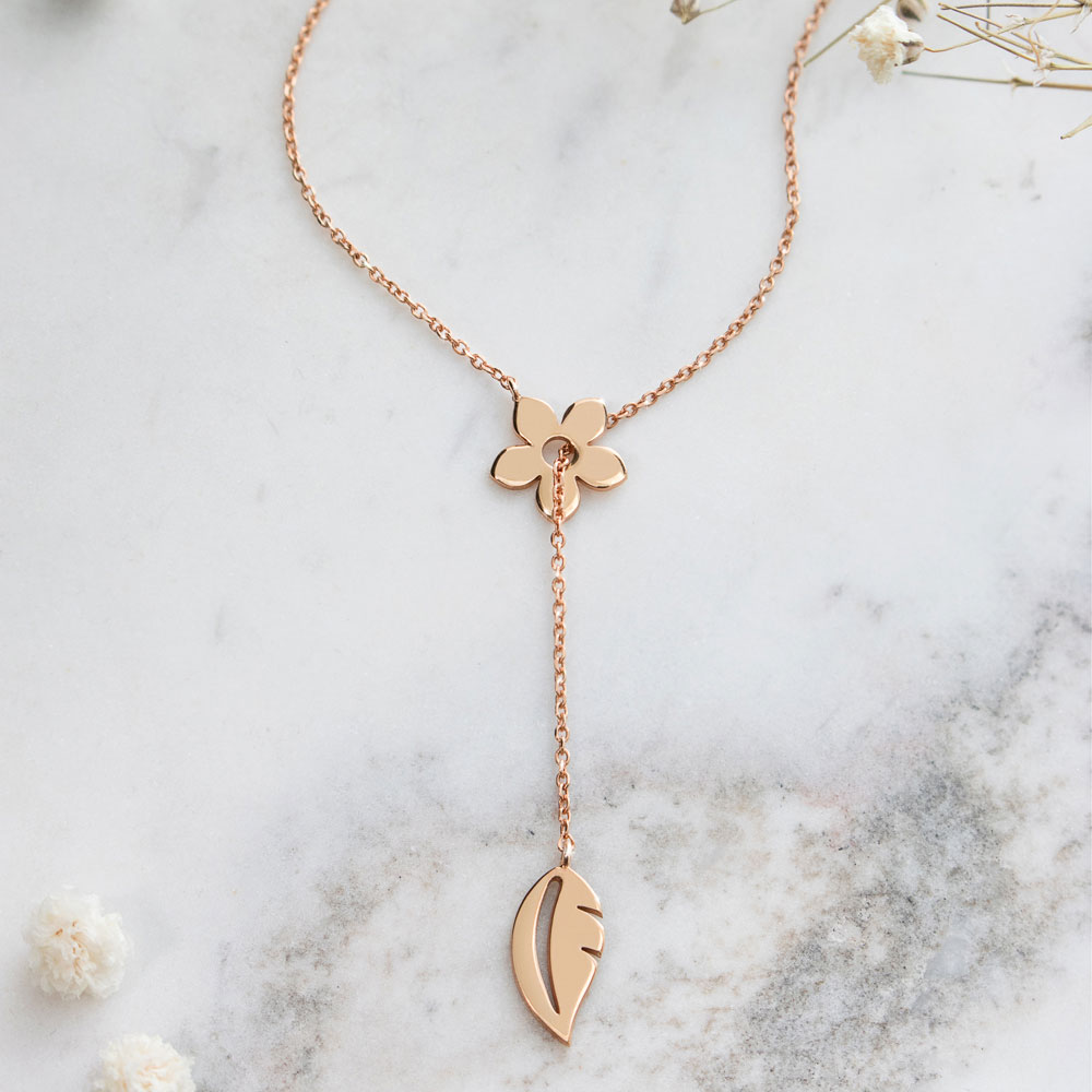 Gold Lariat Style Necklace with a Flower and a Leaf In Rose Gold