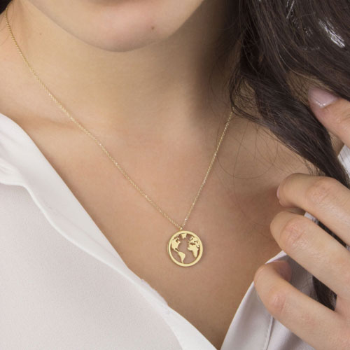 World Map Pendant Necklace in Yellow Gold Worn By A Woman