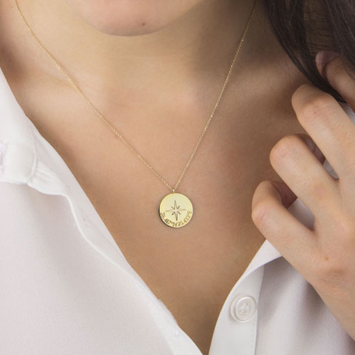 Personalized Compass Pendant Necklace in Yellow Gold Worn By A Woman