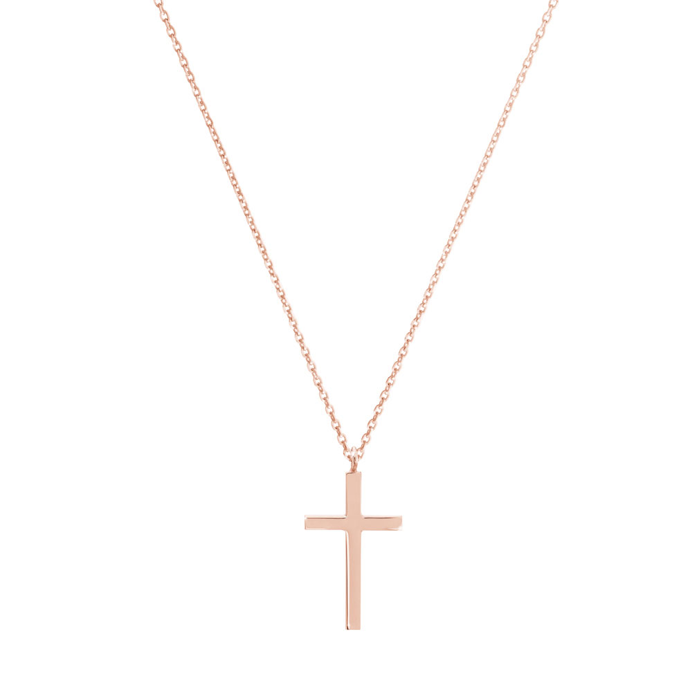 a small thin cross pendant necklace in rose gold