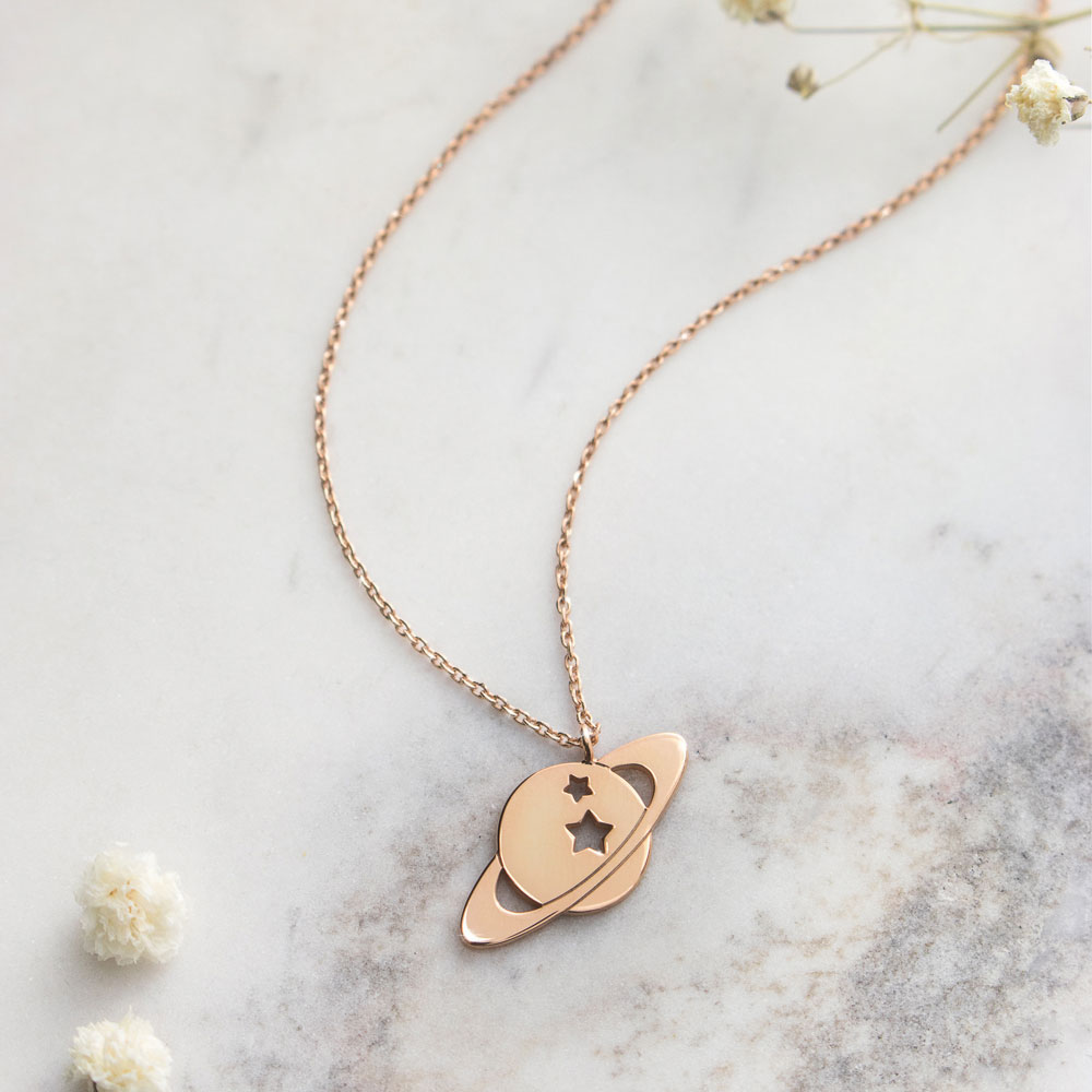 A Saturn pendant necklace in rose gold