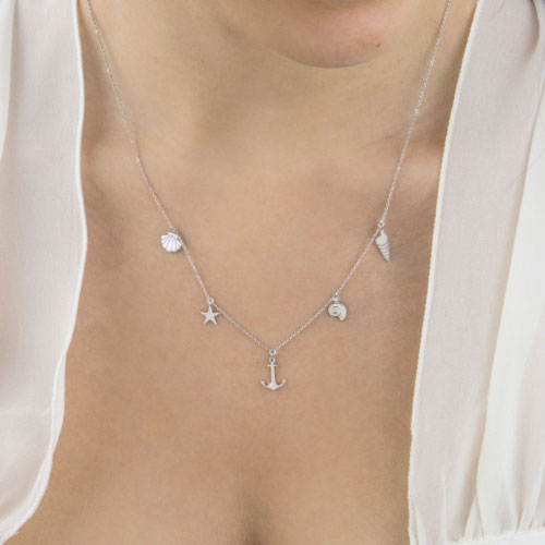 Multi Sea Charms Necklace made of White Gold Worn By A Woman