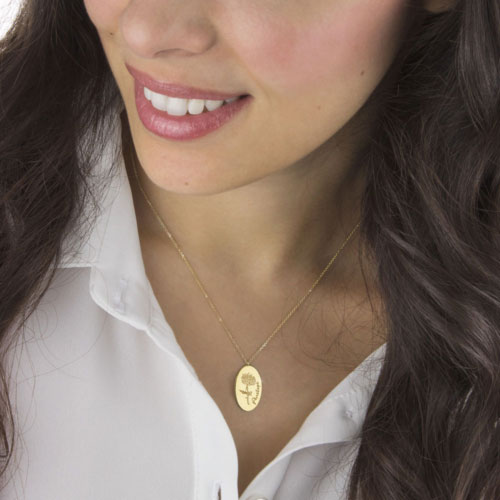 Birth Month Flower Pendant Necklace in Yellow Gold Worn By A Woman