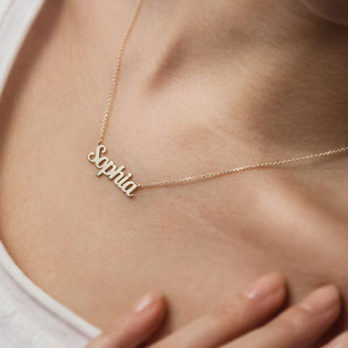 Custom Name Necklace in Yellow Gold Worn By A Woman