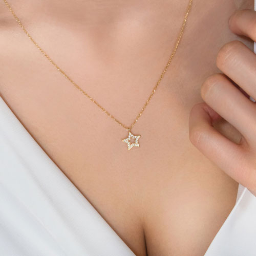 Diamond Star Pendant, Necklace in Yellow Gold Worn By A Woman