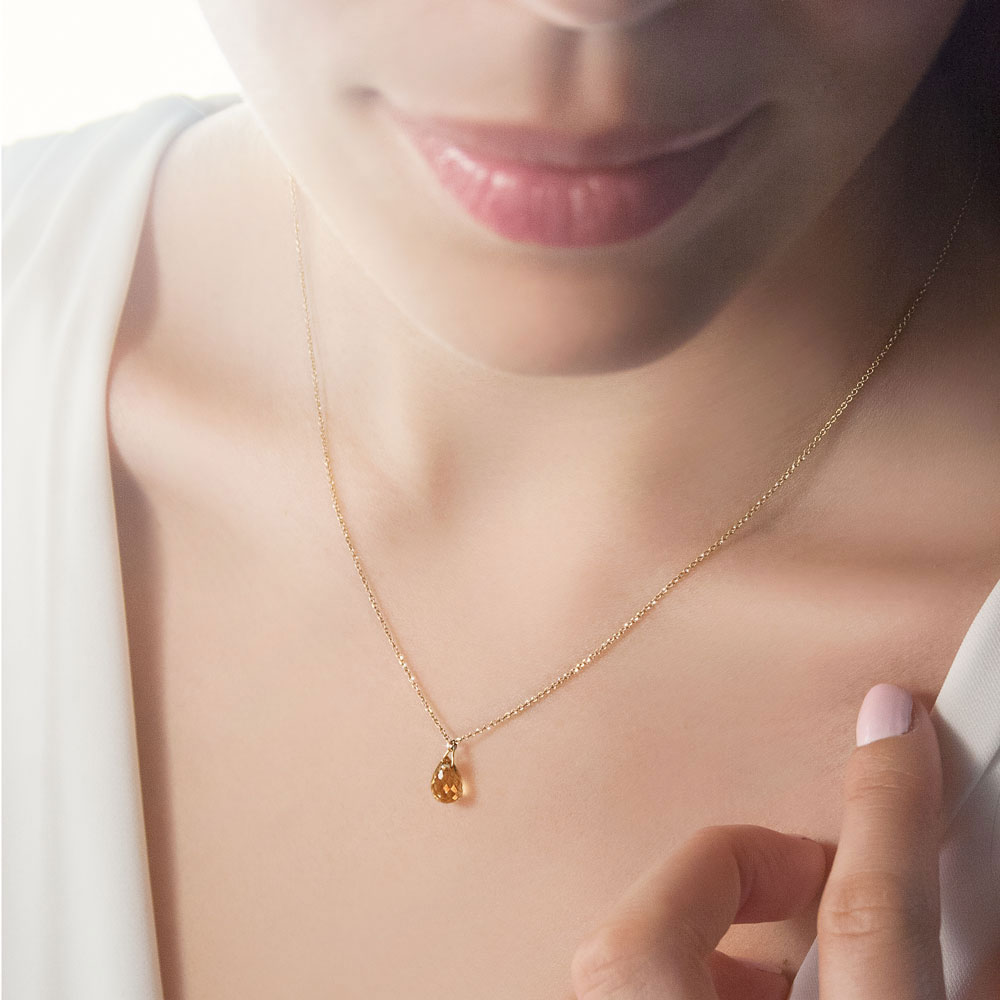 Birthstone Pendant Chain Necklace In Yellow Gold with a Tiny Citrine Worn By A Woman