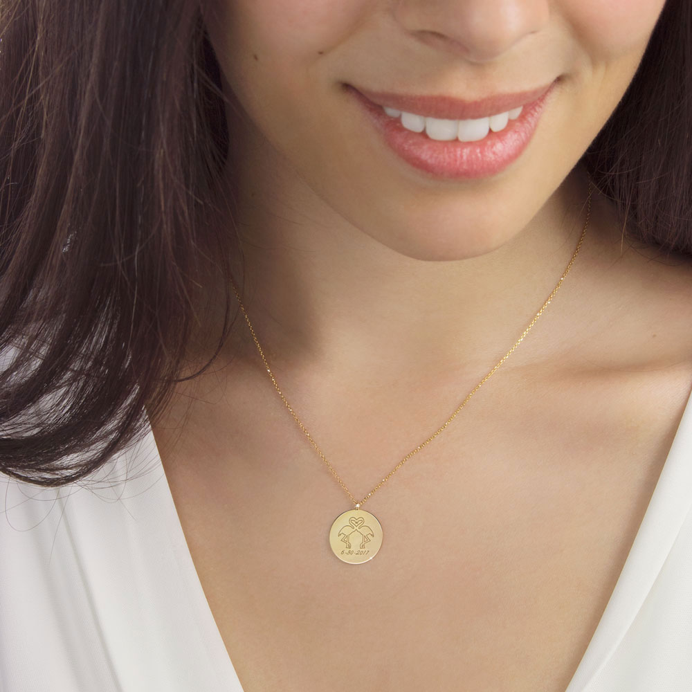 Double Engraved Flamingo Pendant Necklace in Yellow Gold Worn By A Woman