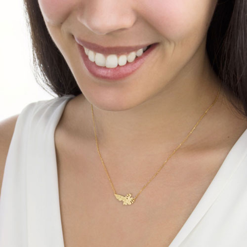 Tropical Bar Necklace with Personalized Engraving In Yellow Gold Worn By A Woman