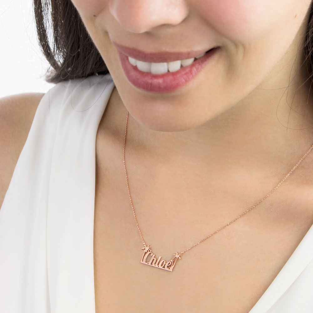 Personalized Necklace with a Name and Palm Trees in Rose Gold Worn By A Woman