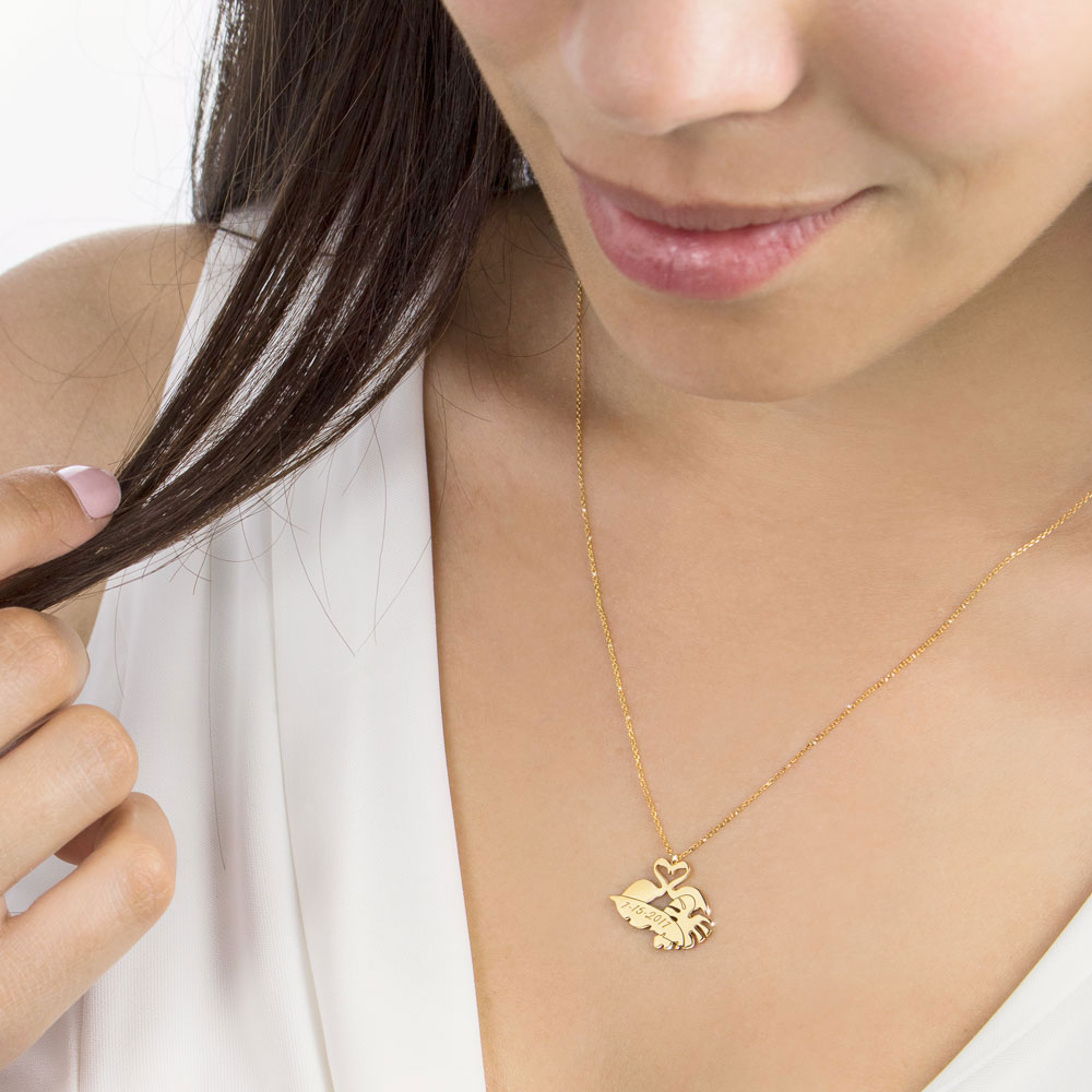 Personalized Pendant Necklace with Flamingos and Tropical Leaves In Yellow Gold Worn By A Woman