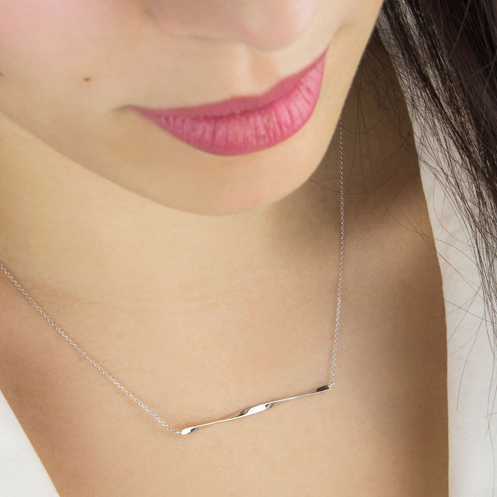 Twisted Bar Necklace In White Gold Worn By A Woman