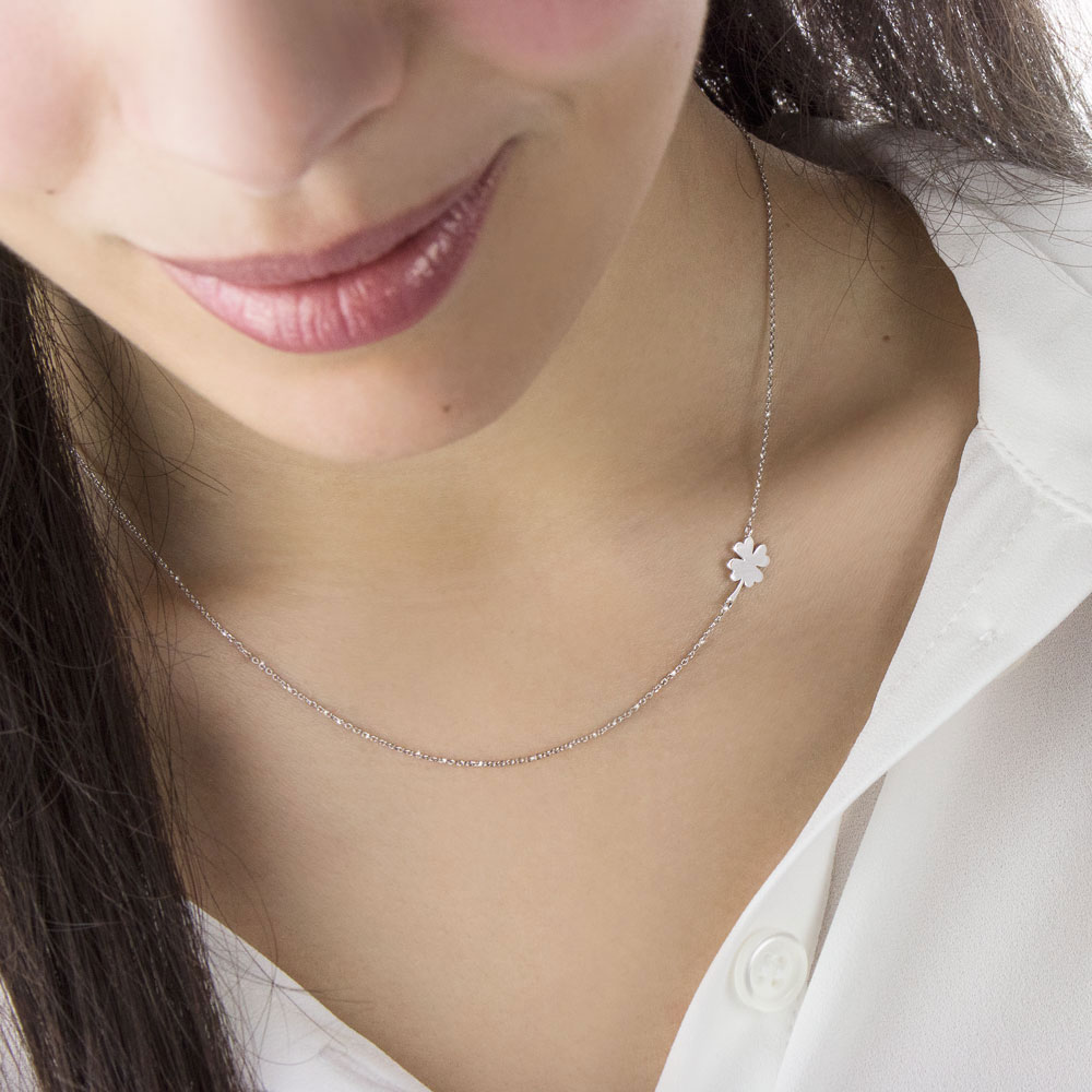White Gold Necklace with a Four-Leaf Clover on the Side Worn By A Woman