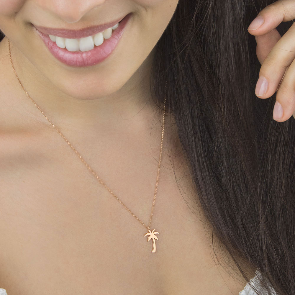 Dainty Palm Tree Pendant Necklace in Rose Gold Worn By A Woman