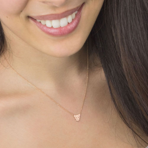 Small Dog Face Charm Necklace in Rose Gold Worn By A Woman