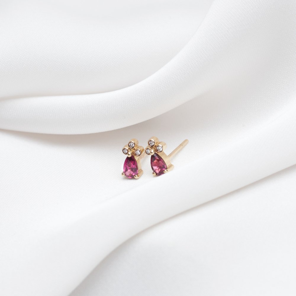 Rhodolites and White Diamond Earrings in Solid Gold on a white background