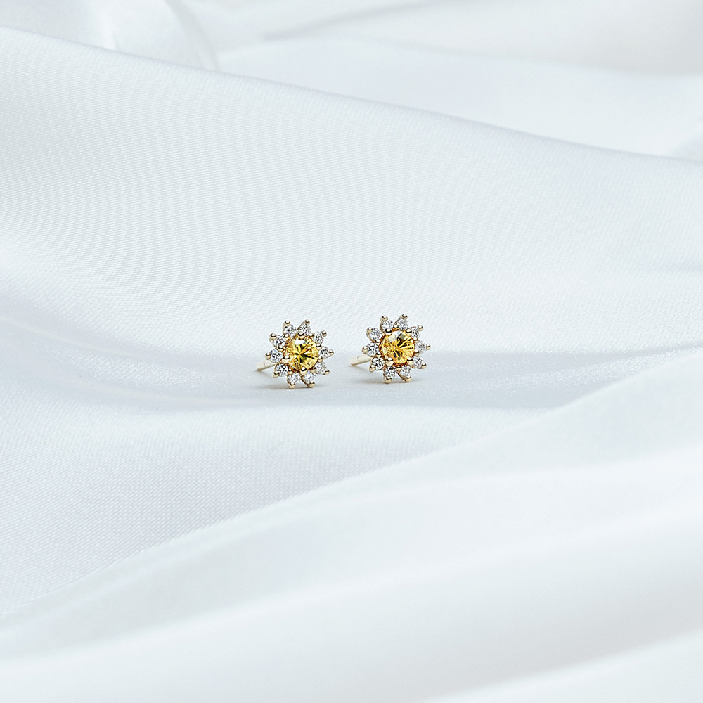 Yellow Sapphire and Diamond Earrings in Solid Gold on a white background
