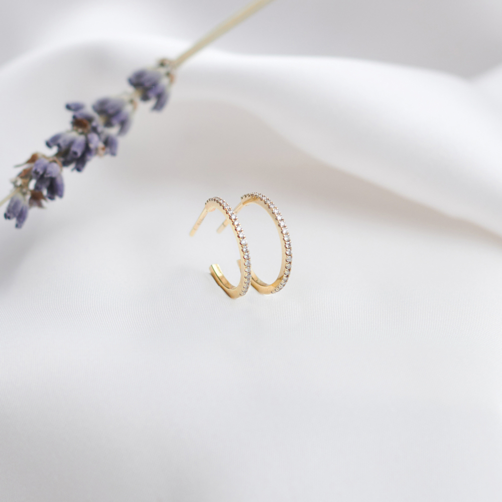 Small Diamond Hoop Earrings in Solid Gold on a white background