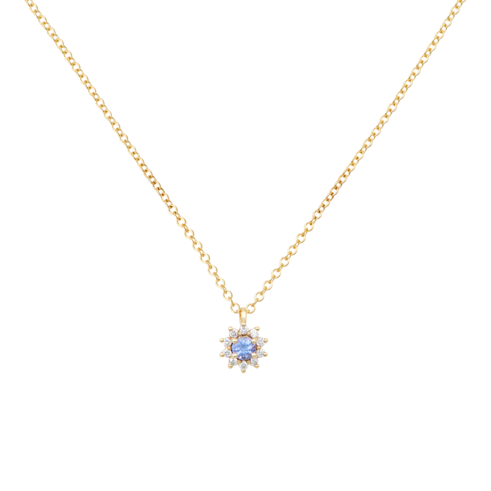 tanzanite pendant with tiny white diamonds in yellow gold