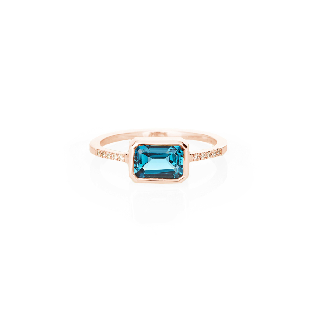 rose gold ring with London blue topaz and white diamonds
