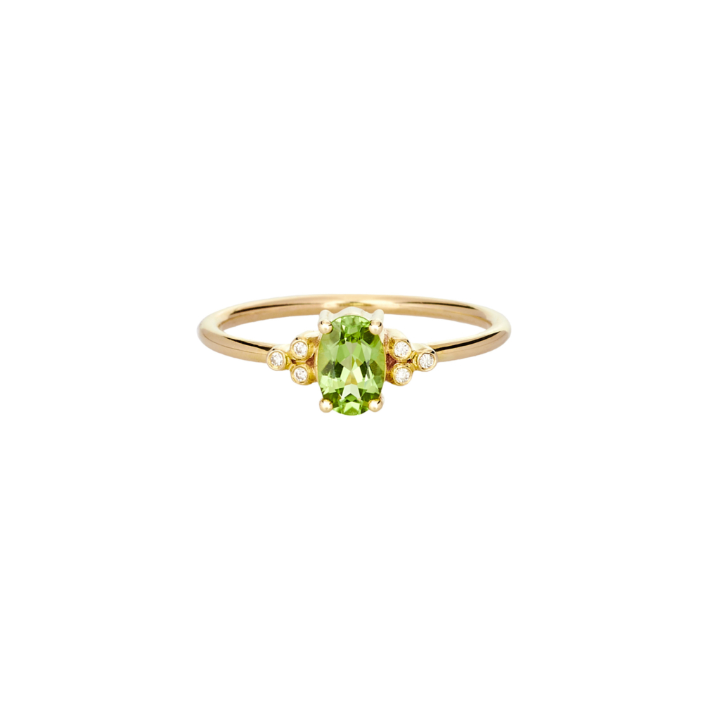yellow gold ring with a peridot and round diamonds