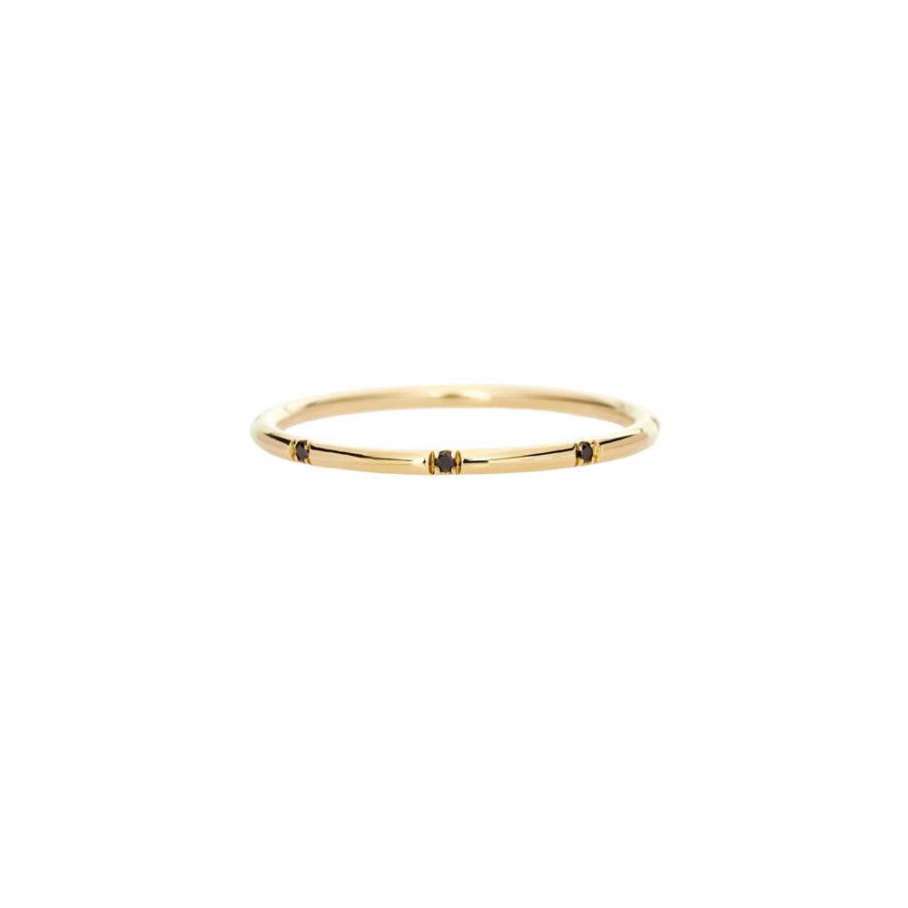 simple round yellow gold ring with black diamonds