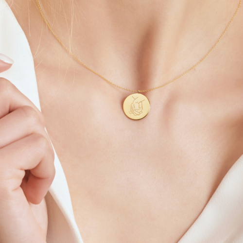 Circle Pendant Necklace with Holding Hands in yellow Gold worn by a model