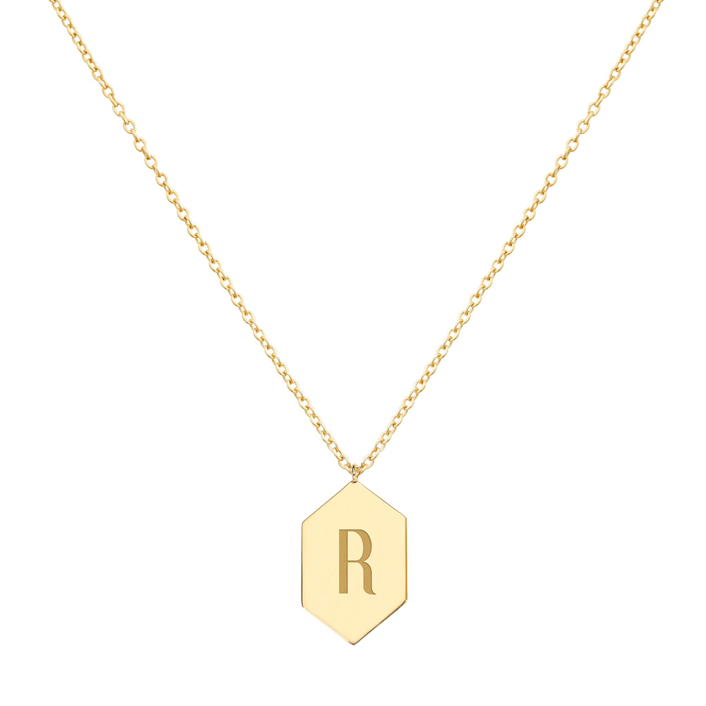 A Hexagon Pendant necklace with an Engraved Monogram in yellow Gold displayed on a white background