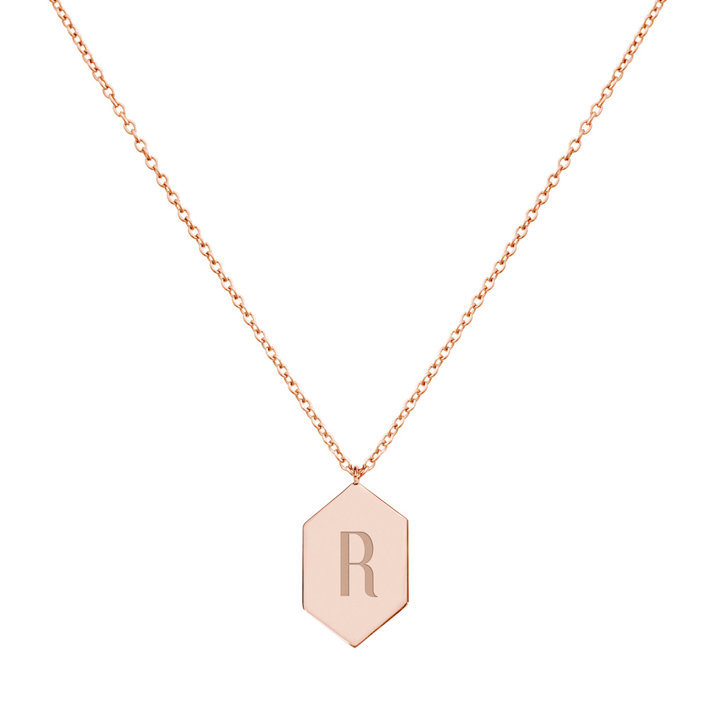 A Hexagon Pendant necklace with an Engraved Monogram in rose Gold displayed on a white background